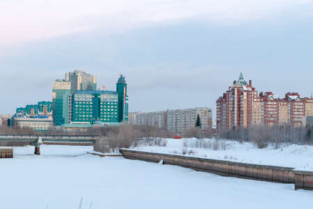 Russia, Surgut, 12/20/2018: Gazprom building in Surgut, view from the embankment of the river Saimaa in the winter morning.のeditorial素材