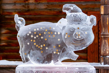 Ice sculpture-a Pig - a symbol of 2019. Ice pig happiness with coins.のeditorial素材