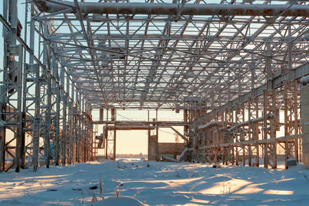 The skeleton of the steel structure of unfinished construction in the winter day.の写真素材