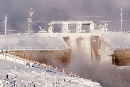 Hydraulic structures are covered with a thick layer of frost on a winter day.の写真素材