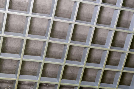 A fragment of a metal decorative lattice for decorating the ceiling.