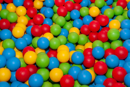 Background of colored plastic balls to fill the children's play area.の写真素材