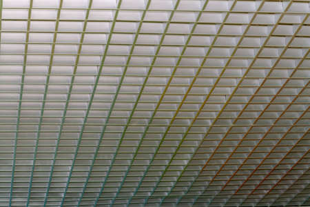 A fragment of a metal decorative lattice for decorating the ceiling.