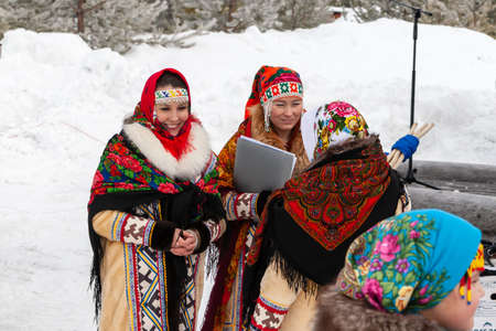 Russkinskaya, Surgut, Russia, 03/23/2019: open traditional holiday of reindeer herders and fishermen, indigenous peoples of Siberia. Participants of the folk group behind the scenes.のeditorial素材