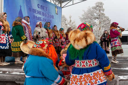 Russkinskaya, Surgut, Russia, 03/23/2019: open traditional holiday of reindeer herders and fishermen, indigenous peoples of Siberia. The performance of the folklore group on the stage.のeditorial素材