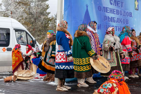 Russkinskaya, Surgut, Russia, 03/23/2019: open traditional holiday of reindeer herders and fishermen, indigenous peoples of Siberia. The performance of the folklore group on the stage.のeditorial素材
