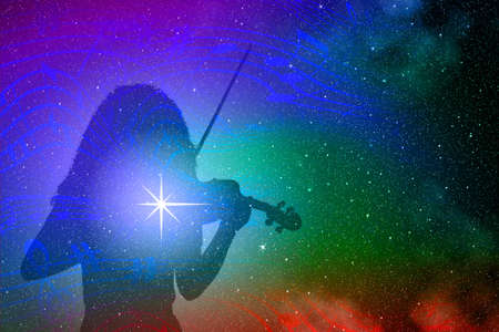 Silhouette of a girl playing the violin on a background of colorful outer space with musical notes and bright stars and nebulaeの写真素材