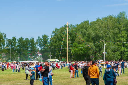 Ufa, Chishmy, Russia, 06.05.2021. National Tatar-Bashkir holiday Sabantuy. Exhibition of agricultural machinery. Children play on the Kirovets tractor.のeditorial素材
