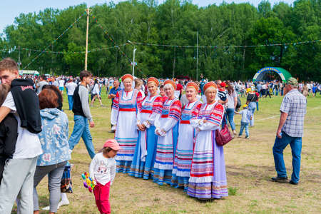 Ufa, Chishmy, Russia, 06.05.2021. National Tatar-Bashkir holiday Sabantuy. Exhibition of agricultural machinery. Children play on the Kirovets tractor.のeditorial素材