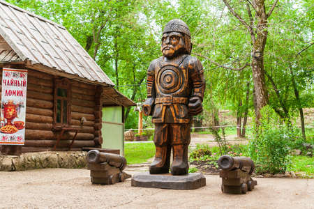 Kungur, Russia, 07.22.2021 The territory of the tourist complex is the Kungur Ice Cave. Stylized wooden sculpture of a Russian hero.のeditorial素材
