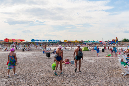 Sol-Iletsk, Russia, 07.27.2022. Salt lake beach. People at the Sol-Iletsk resort.のeditorial素材