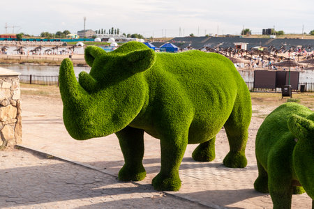 Sol-Iletsk, Russia, 07.27.2022. Topiary composition in Sol-Iletsk resort. Green nasorog topiary.のeditorial素材