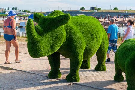 Sol-Iletsk, Russia, 07.27.2022. Green nasorog topiary. Topiary composition in Sol-Iletsk resort.のeditorial素材