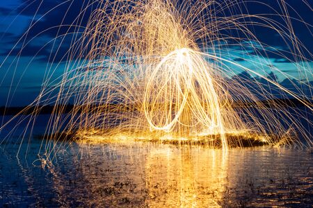 Image playing fireworks by rotating the wave shape of the lines, sparks to light. Amazing Fire Dance...