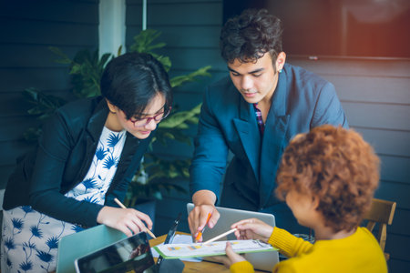 Young Asian office worker brainstorming for company business success. teamwork concept.