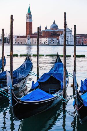 Gondolas in Venice, Italy at sunriseの写真素材