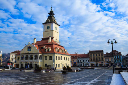 Council Square and Council building in Brasov, Romania in wintertime, on a clear sunny dayの写真素材