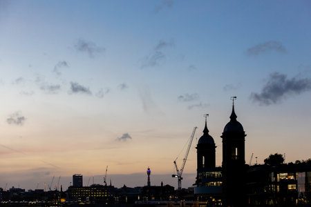 London by night - view from the river Thames. London, England (UK). Silhouettes of architectural monumentsの写真素材