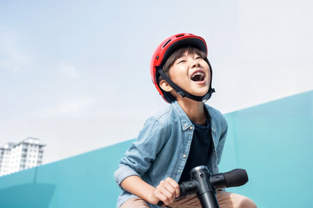 Joyful Asian Boy Riding Scooter. Generative AIの素材
