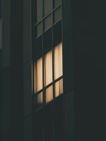 Reflective window of a modern office building in the evening.の素材