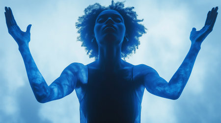 Portrait of a young african american woman in blue lightの素材