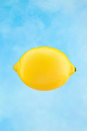 Lemon floating in the air on a blue background. 3d renderingの素材