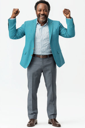 Full length portrait of happy african american businessman clenching fistsの素材