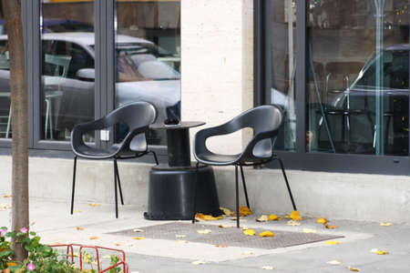 empty restaurant terrace on city streetの写真素材