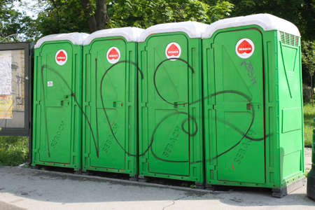 A row of four portable toilet bathroom in Tmisoara Romaniaの写真素材