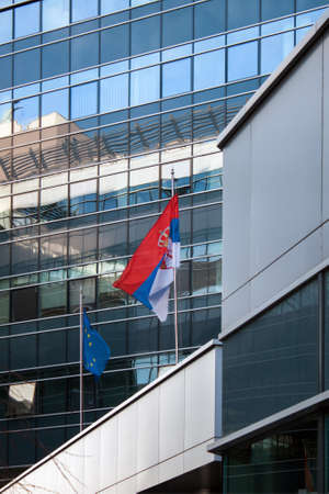 Flags of the European Union and Serbia wavingの写真素材