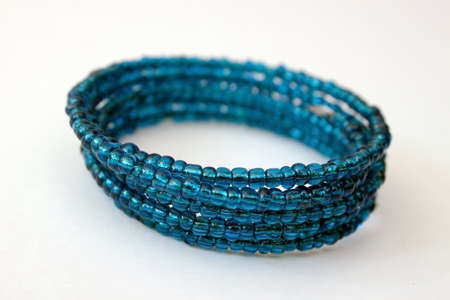 Blue beaded bracelet on a white backgroundの写真素材