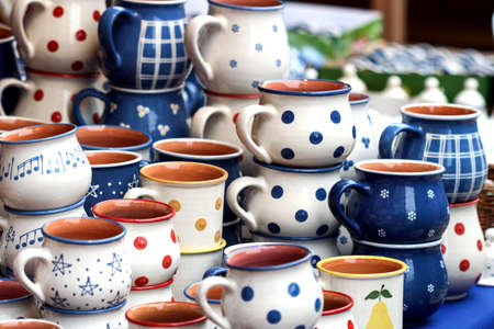 Lots of colorful pottery in the marketの写真素材