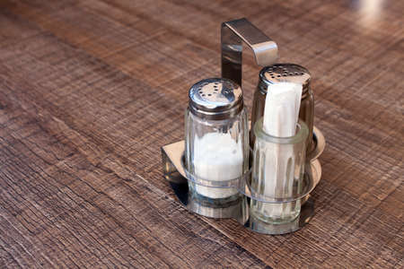 Excellent shot of Salt and Pepper on a wooden table.の写真素材