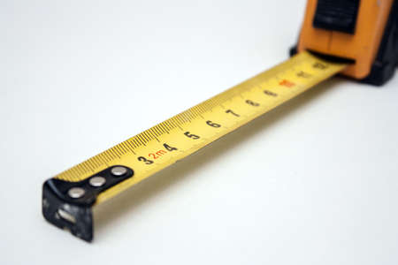 isolated yellow tape measure dropping out of focus