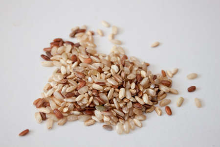 Pile of Brown Rice Isolated on White Backgroundの写真素材