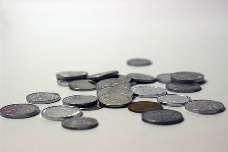 Coins on the top of white isolated backgroundの写真素材