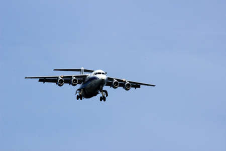 The wing flaps have been opened, the landing gear has also been prepared, the communication is getting more intense between the pilot and the ATC tower. The plane prepares for landingの写真素材