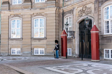 Copenhagen, Denmark - March 19, 2019: the Royal Life Guards (Den Kongelige Livgarde) march from Rosenborg Castle at 11.30 am daily through the streets of Copenhagen and execute changing the guard in the inner square of The palaces (or mansions) of Amalienのeditorial素材
