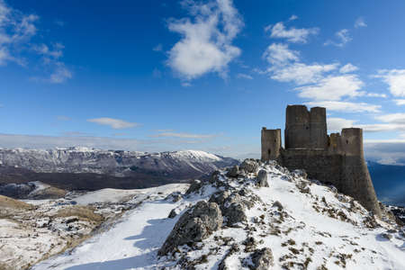 Ancient fortress in the Abruzzesi mountains, snowy mountain landscape of Campo Imperatore - Piana dei Novelli, Italyのeditorial素材