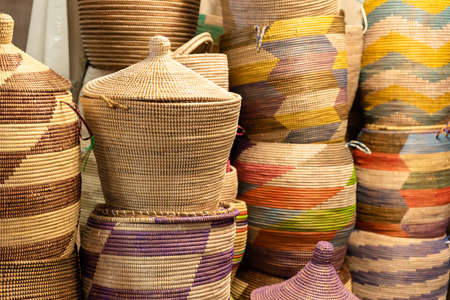 Large hand-made colored baskets in an African market, horizontal imageの写真素材