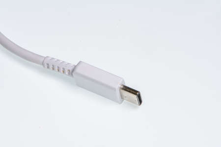 detail of a white usb-c connector on a white background