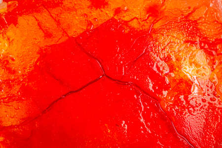 Image of blood-colored liquids mixed with other organic fluids, abstract chemical detailの写真素材