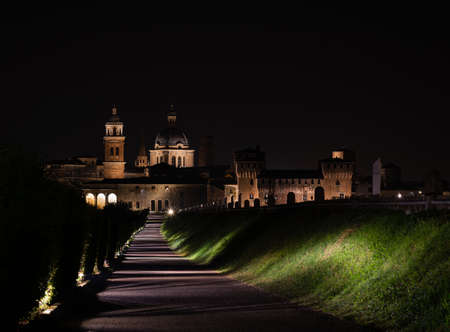 Night walk towards the city of Mantua, Italian urban landscape illuminated by night lightsのeditorial素材