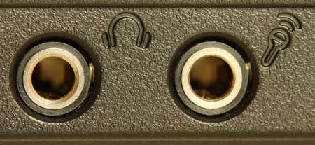 Audio sockets on the side of a black laptopの写真素材