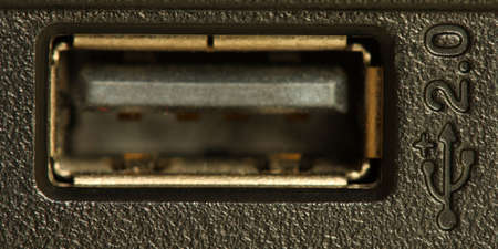 USB socket on the side of a black laptopの写真素材