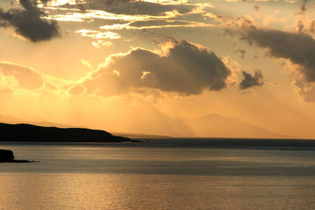 sunset seen from matala bay on the island crete in Greeceの写真素材