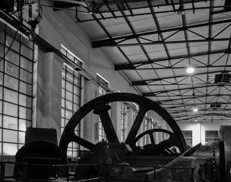 An old machine hall with large flywheels for power generation.