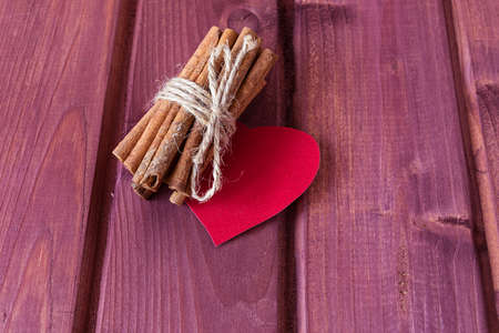 Cinnamon sticks and heart toned selective focusの写真素材