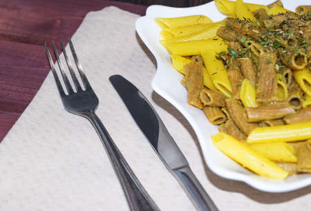Mixed rye and classic wheat pasta with spices and herbes de Provenceの写真素材
