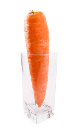 Raw single Carrot in glass isolatedの写真素材